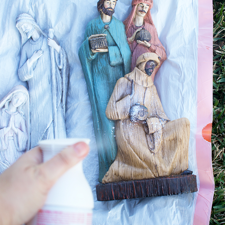 How To Spray Paint Over A Multicolored Nativity Set- spraying can of paint