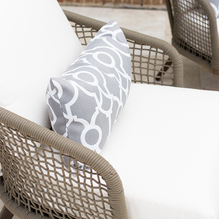 gray and white outdoor lumbar pillow